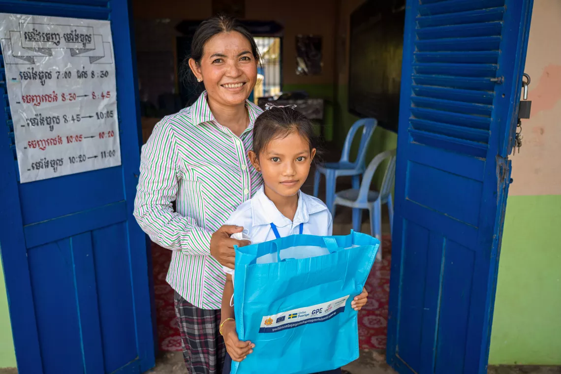 02 November 2021, Portrait of Weng Riya, 8-year-old student, and her mother Ek Nary