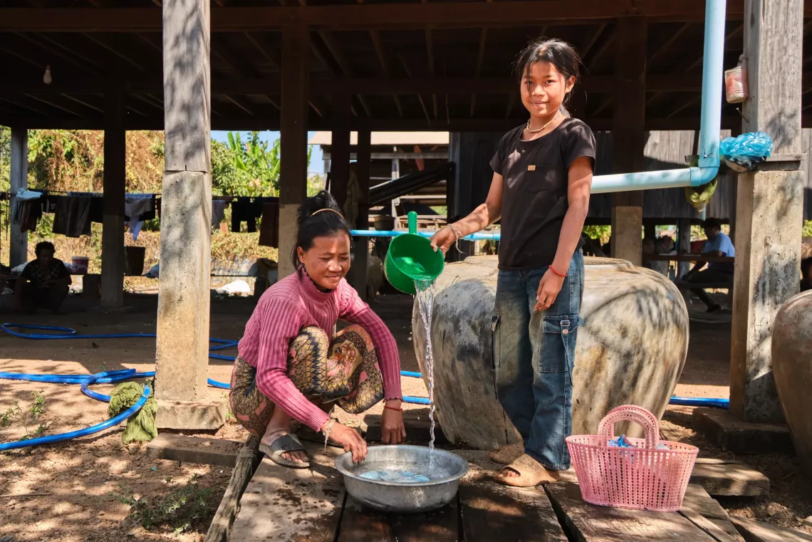 39-year-old Huong Meng and her daughter, 12-year-old Hoy Sreyva, now have access to clean piped water at home, reducing Sreyva&lsquo;s chance of dropping out of school  