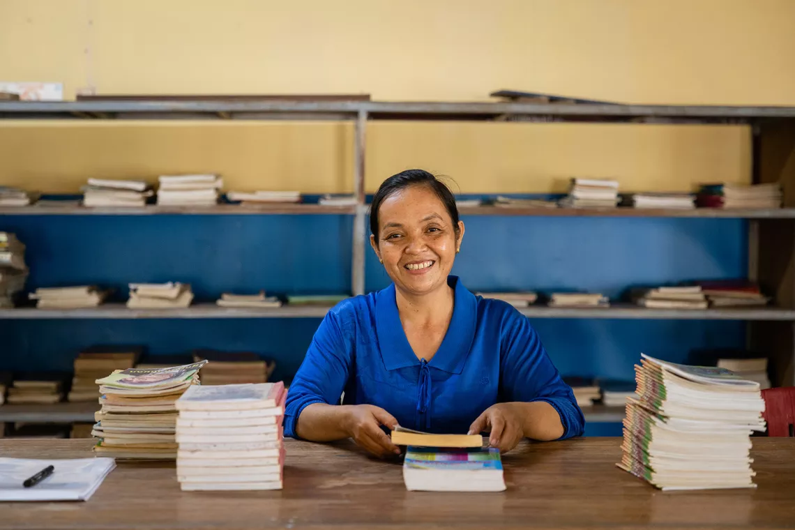 Ms Nheup Huoy, 43, a librarian at Samdech Krom Preah Ang Roneab High School, posed for a photograph in her school&rsquo;s library after sharing bout how Menstruation Health Management (MHM) has been implemented at her school in Takeo Province, Cambodia.