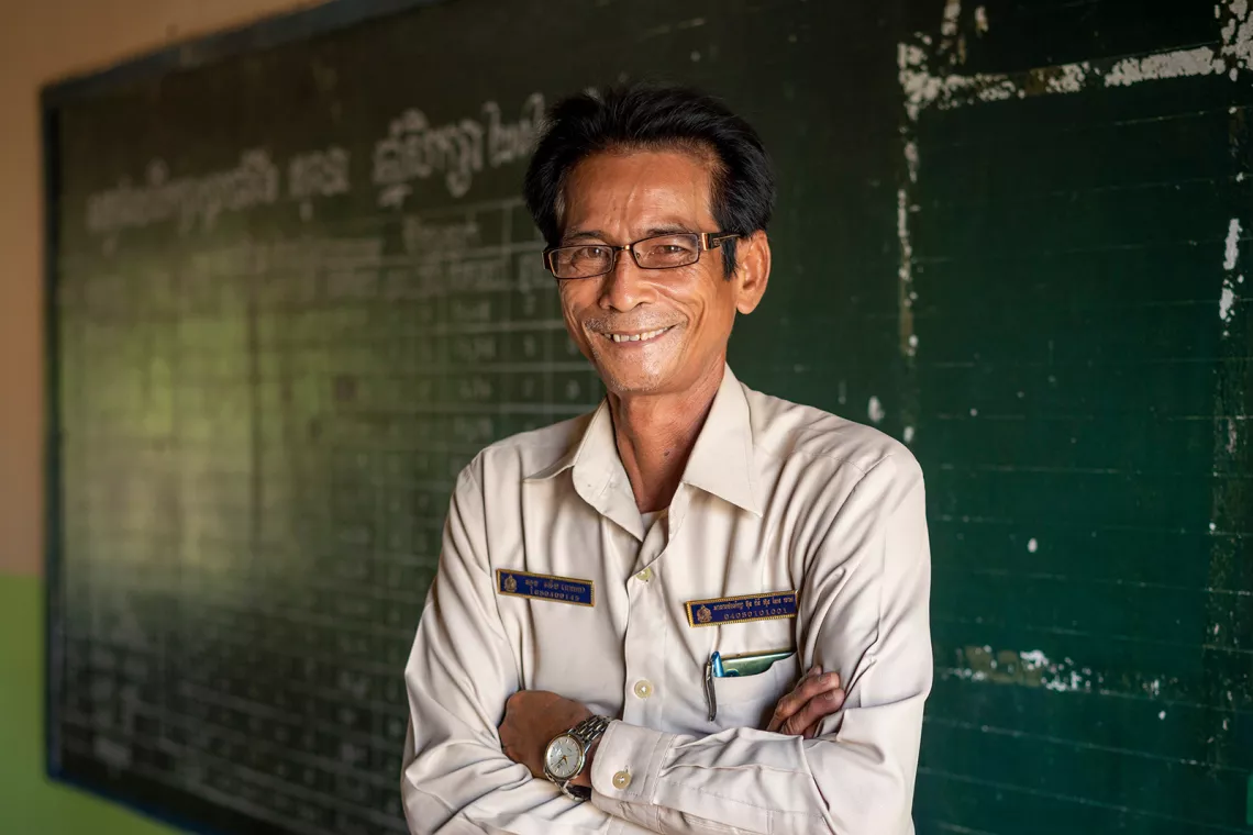 02 November 2021, Bunrany Hun Sen Romeas Primary School, Sre Tachey Commune, Teuk Thos District, Kampong Chhnang,&nbsp;Cambodia. Portrait of the school principal, Sok Weng, 54 years old. Sok Veng has been in education since 1984. Throughout COVID he has been determined to prevent any children at his school from dropping out. He has been successful and believes the Home Learning Packages will be crucial in helping children not just return but catch up.&nbsp;