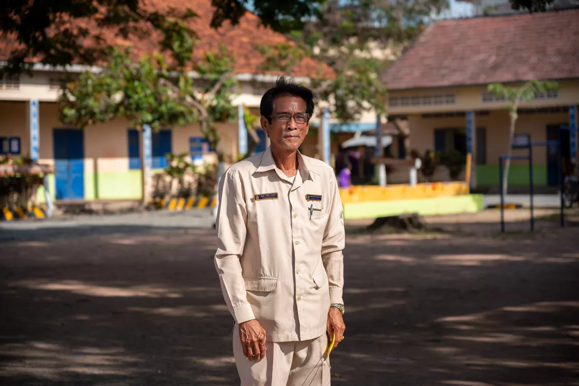 02 November 2021, Bunrany Hun Sen Romeas Primary School, Sre Tachey Commune, Teuk Thos District, Kampong Chhnang,&nbsp;Cambodia. Portrait of the school principal, Sok Weng, 54 years old. Sok Veng has been in education since 1984. Throughout COVID he has been determined to prevent any children at his school from dropping out. He has been successful and believes the Home Learning Packages will be crucial in helping children not just return but catch up.&nbsp;