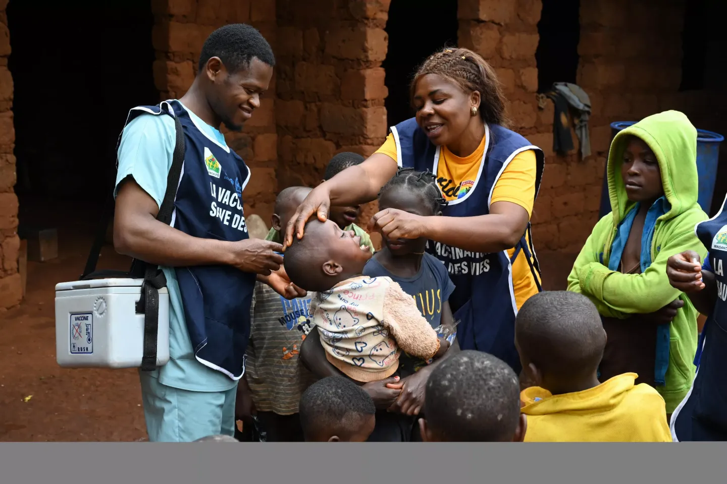 community health workers delivering vaccines to children in the West Cameroon