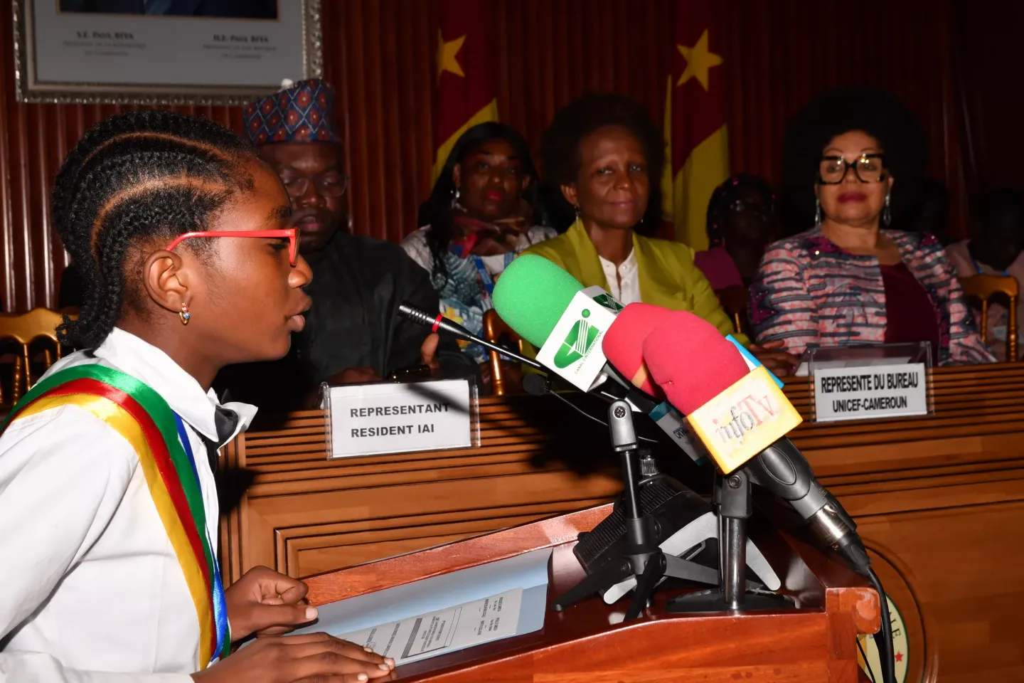 a junior parliamentairian speaking in the national Assembly during African Youth Day
