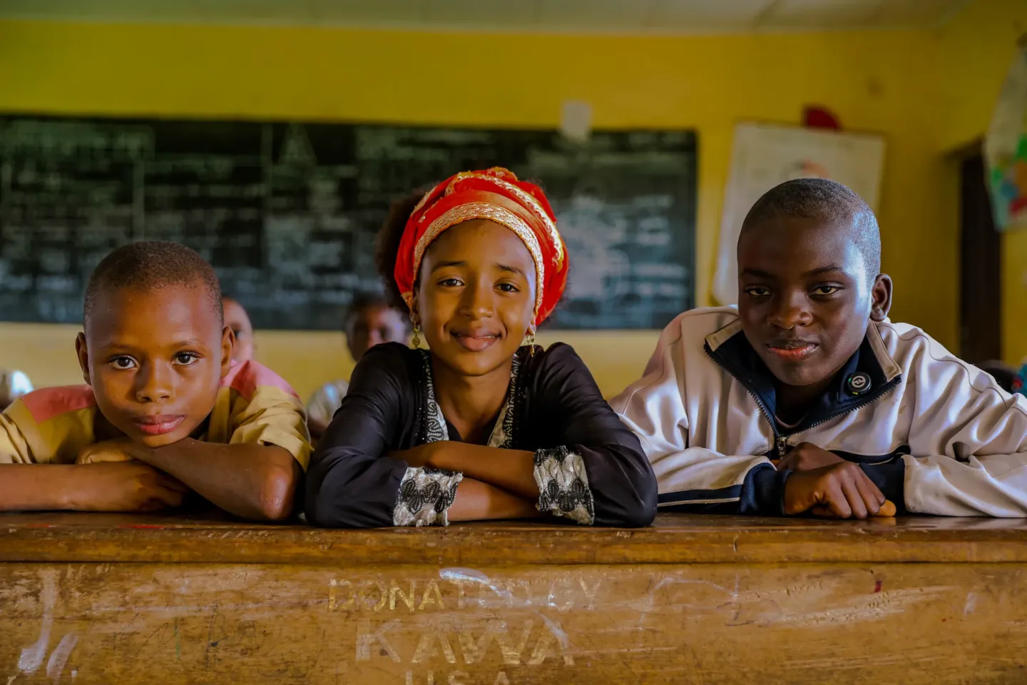 Aminatou, Ali Baba and Treasure in a classroom in the South-West region