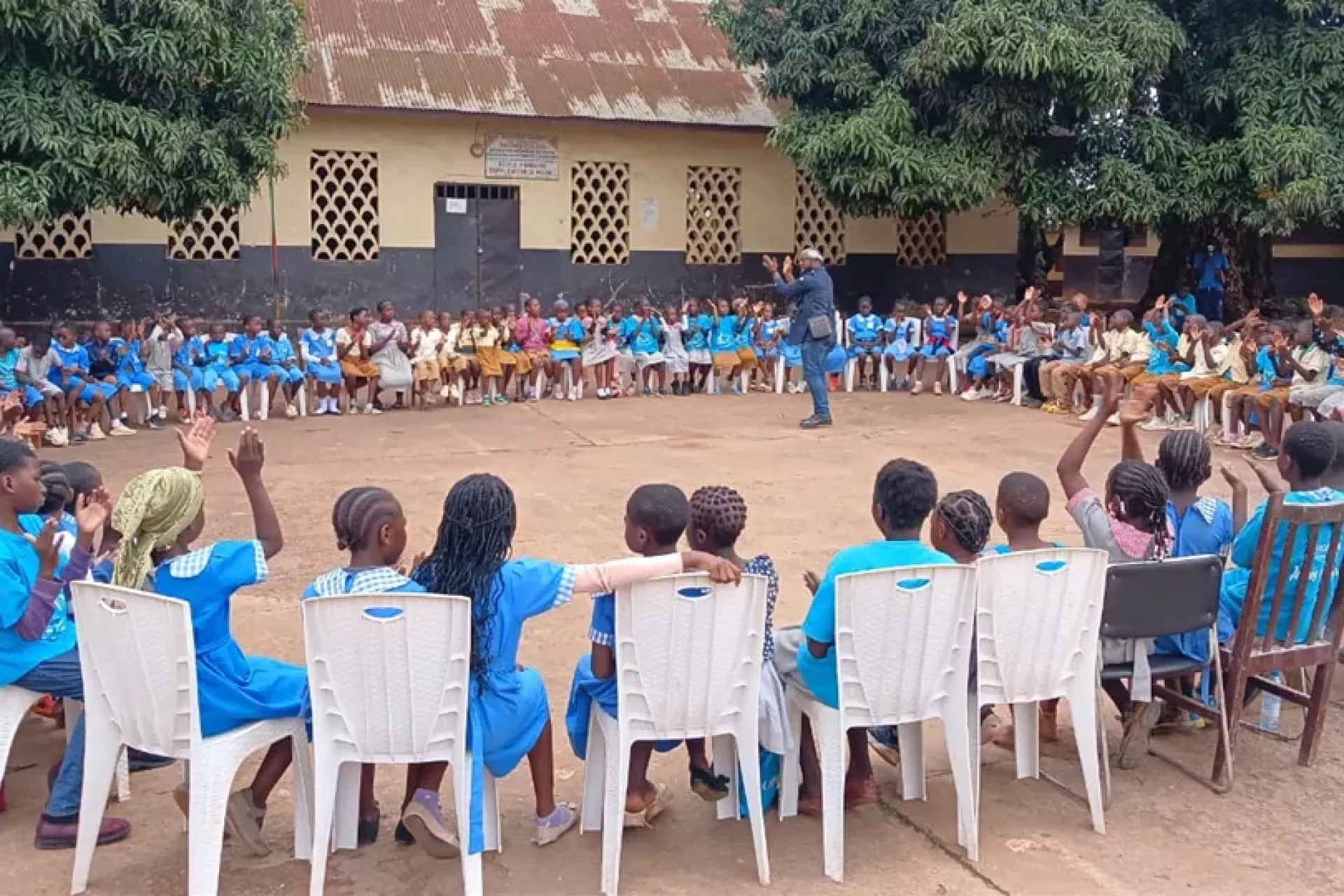I am music session with children sitting in circle in Melen public school