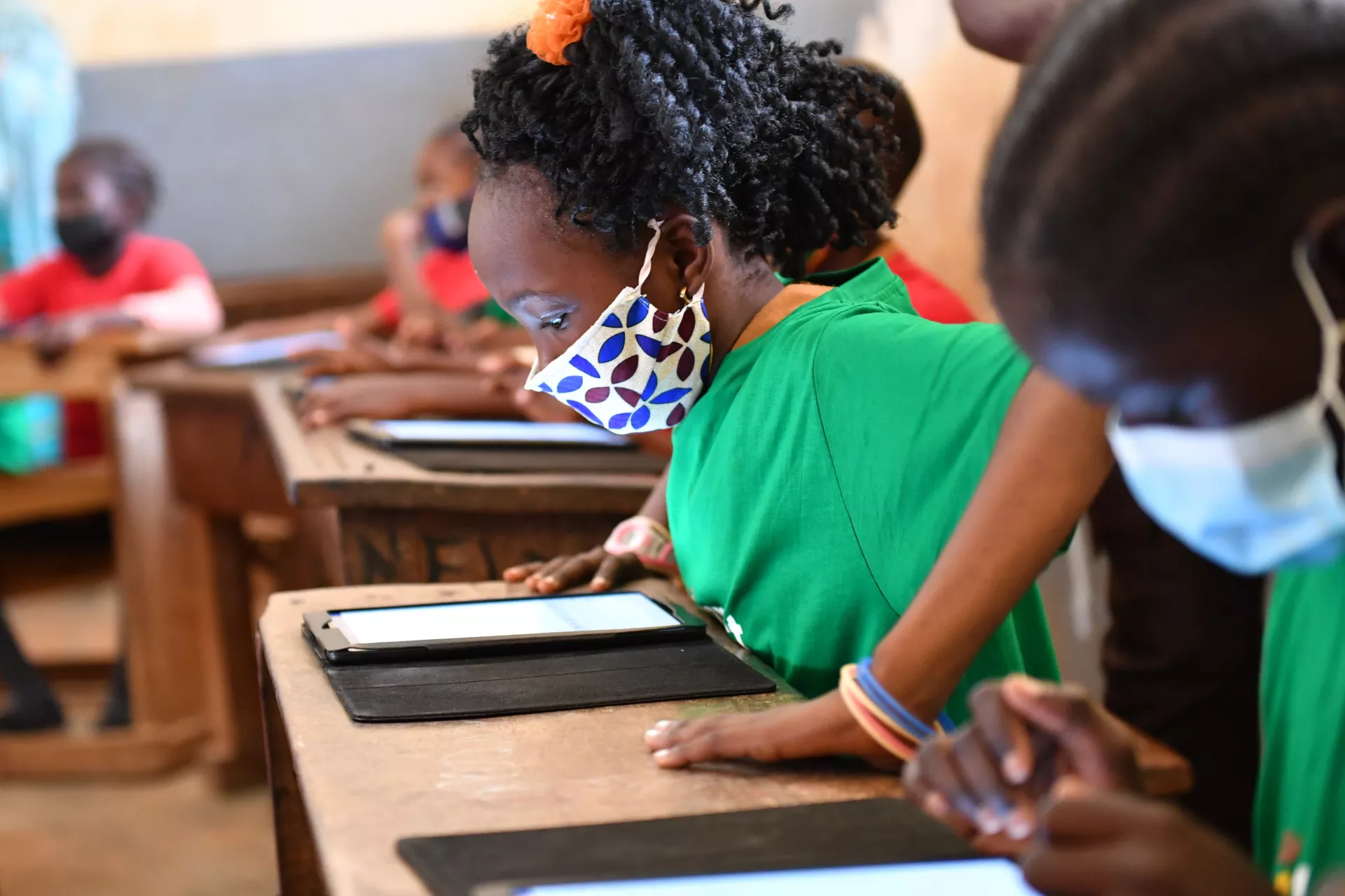 students using the tablets in the classroom