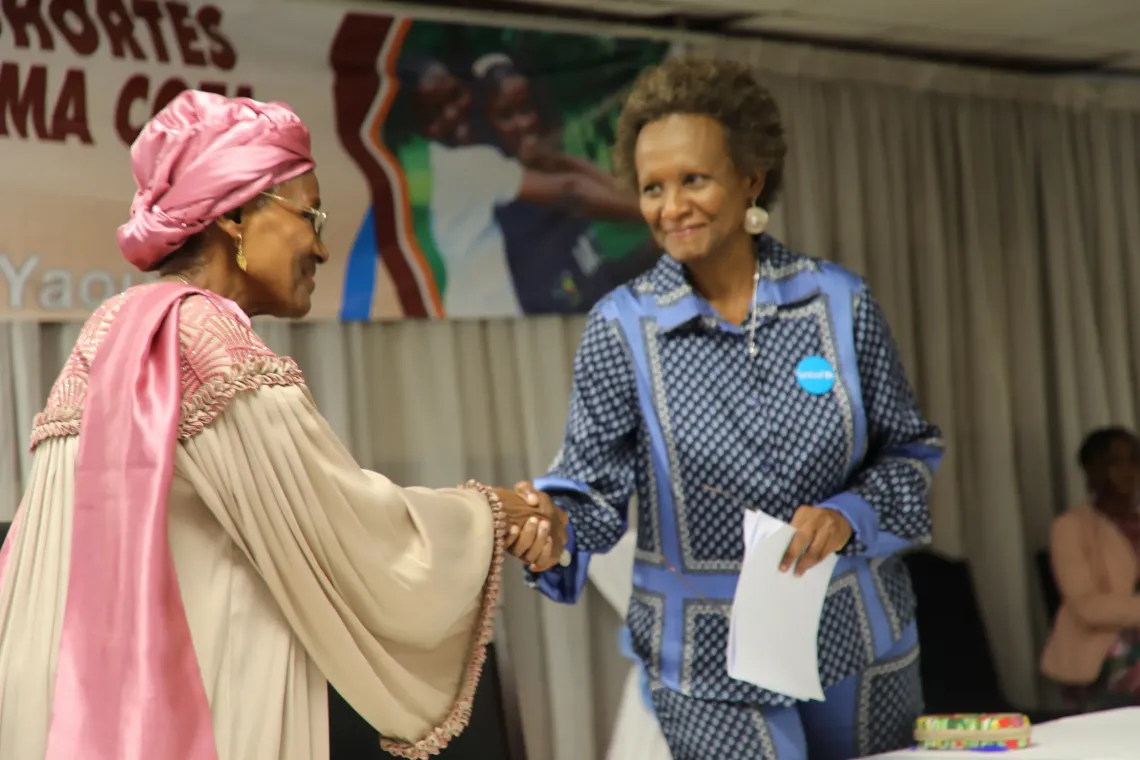 Ministry for the Promotion of Women and the Family and UNICEF Representative shaking hands during MA COTA ceremony