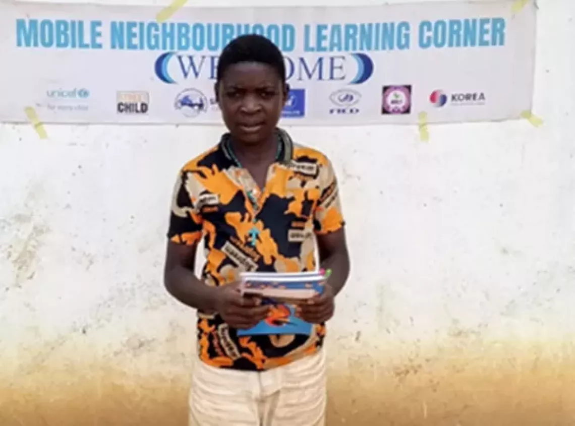 Emmanuel with his books in north-west Cameroon
