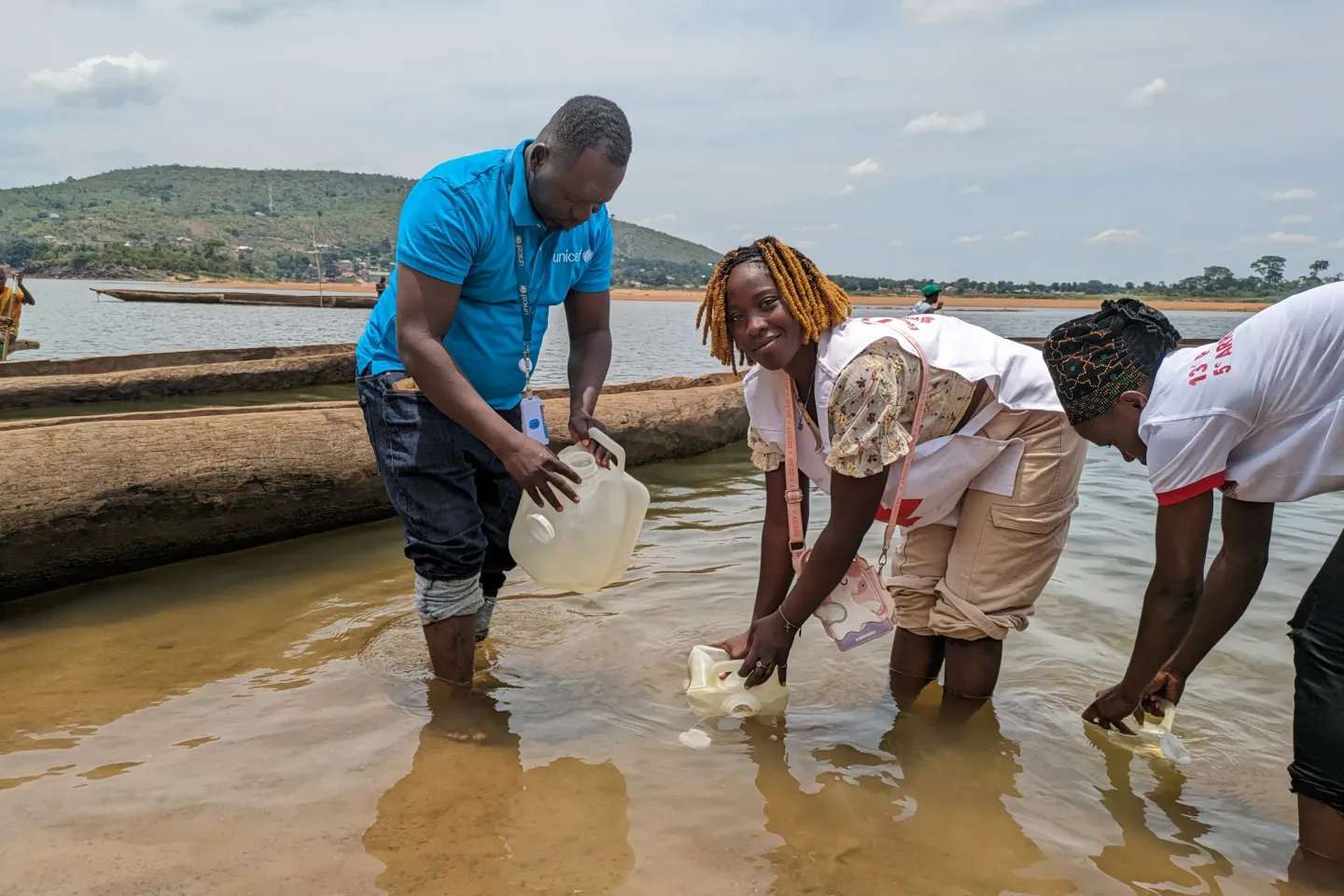 UNICEF&rsquo;s Simplice Beweli and two staff from the Ministry of Humanitarian Action collect water from the Oubangui River during a practical training session on water-purification methods.  