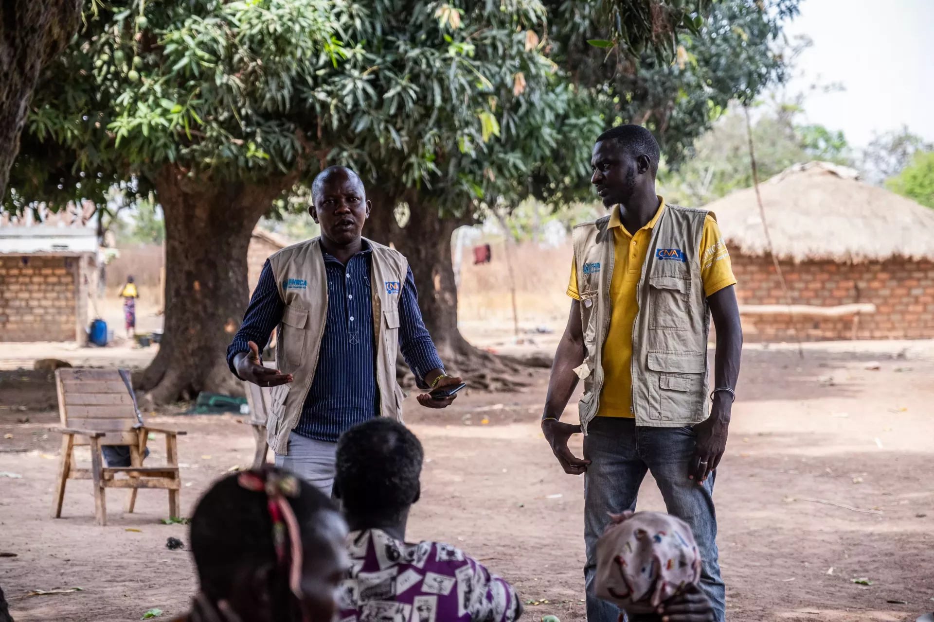 Achille and Wesley, feedback mobile agents in Paoua, exchange with the community in Betokomia