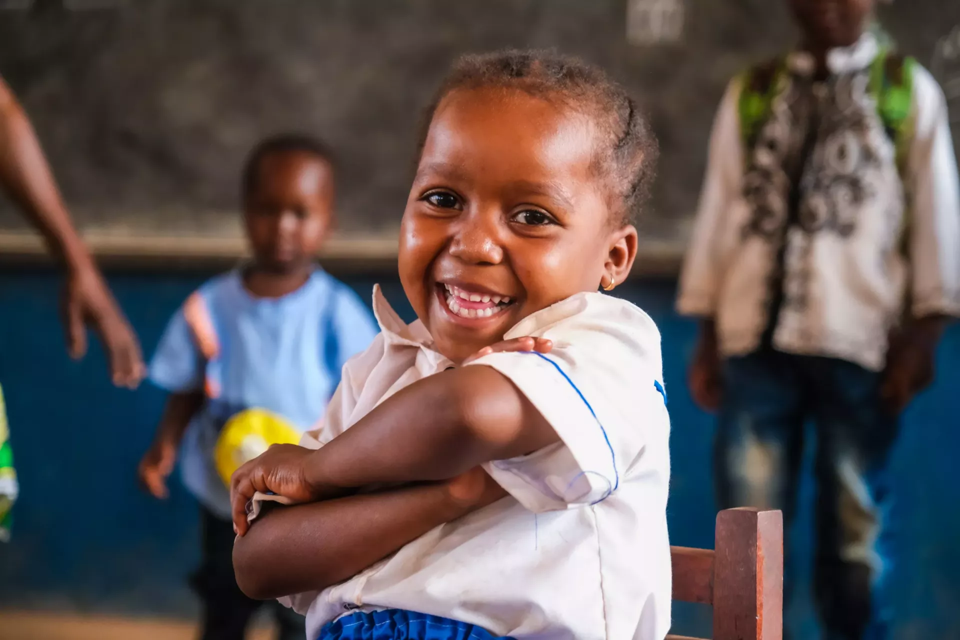 A girl smiles at her classroom of Difolo primary school, Berberati