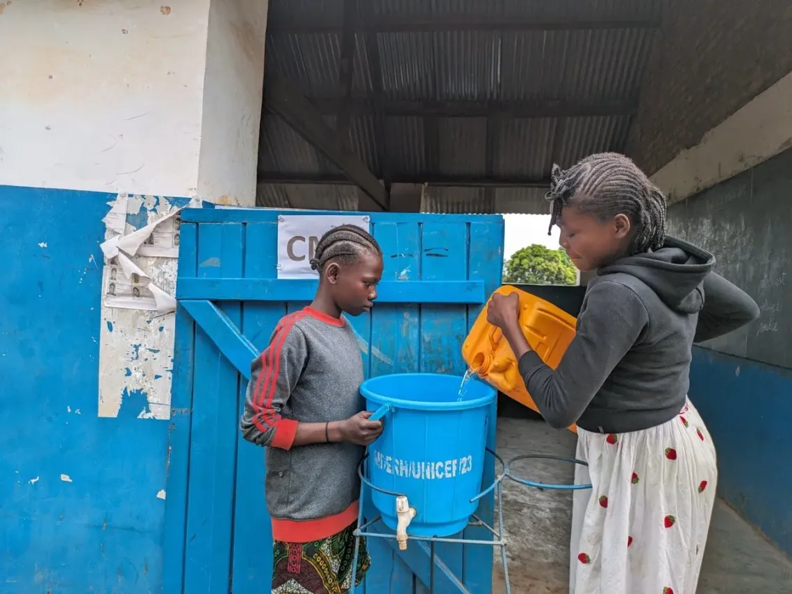   Thanks to a water point installed at their school in Sibut, the students use a hand-washing facility at the entrance of their classroom