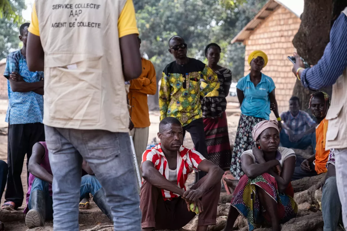 Th&eacute;ophile, a resident of Betokomia, takes part in a discussion between mobile feedback agents and the community.  