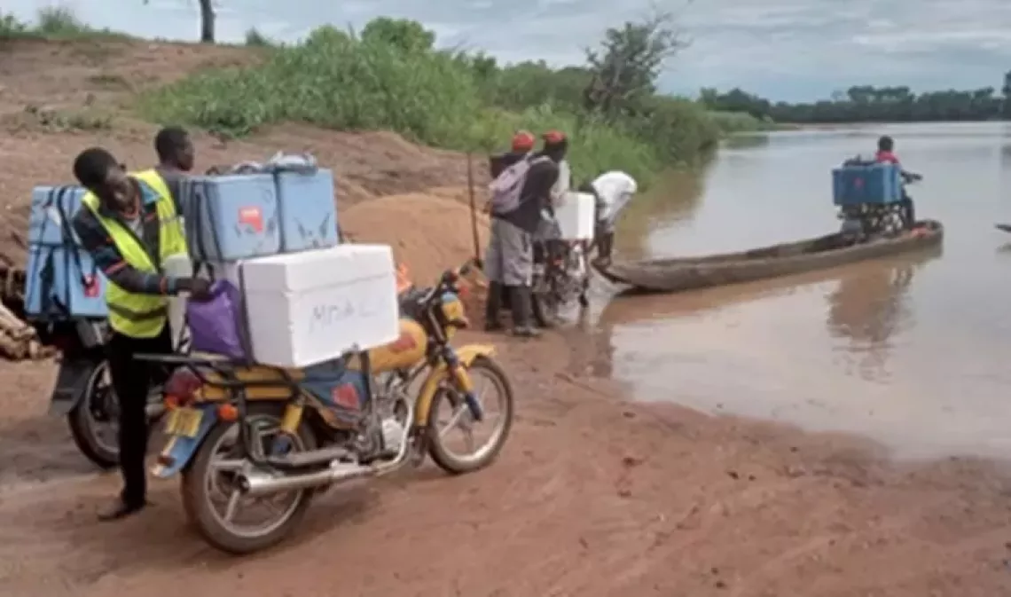UNICEF partners tirelessly dugout canoe to deliver vaccines to children in the most hard-to-reach areas.