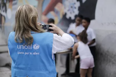 UNICEF employee capturing with a camera