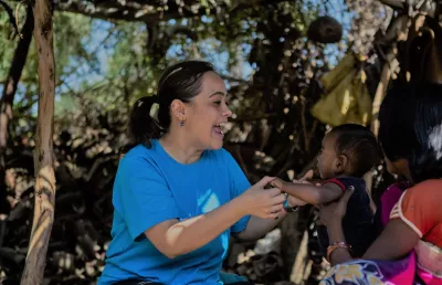 A UNICEF staff playing with children in India