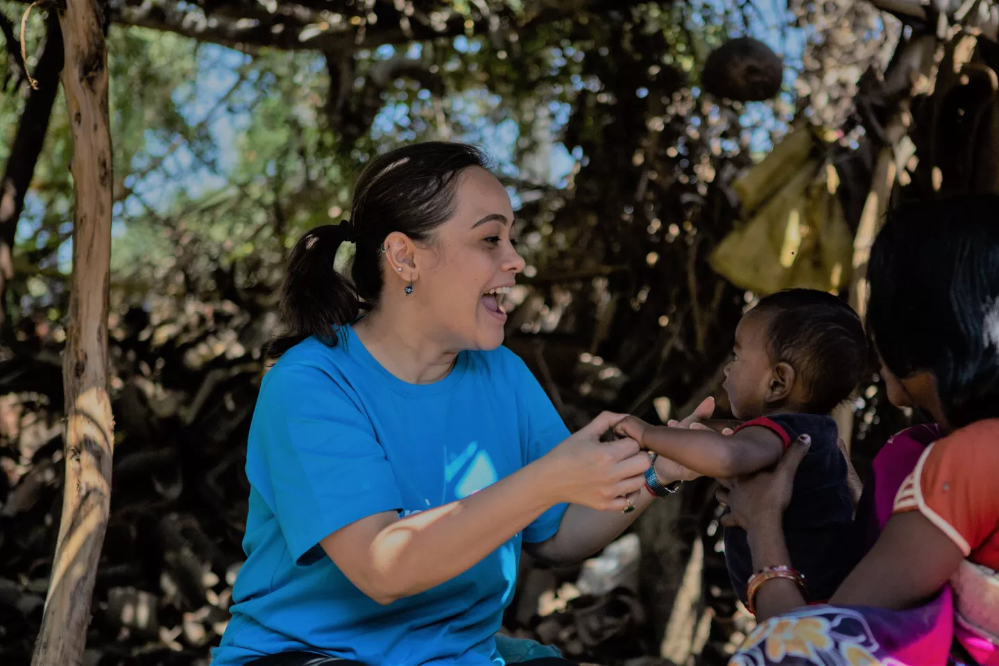 A UNICEF staff playing with children in India