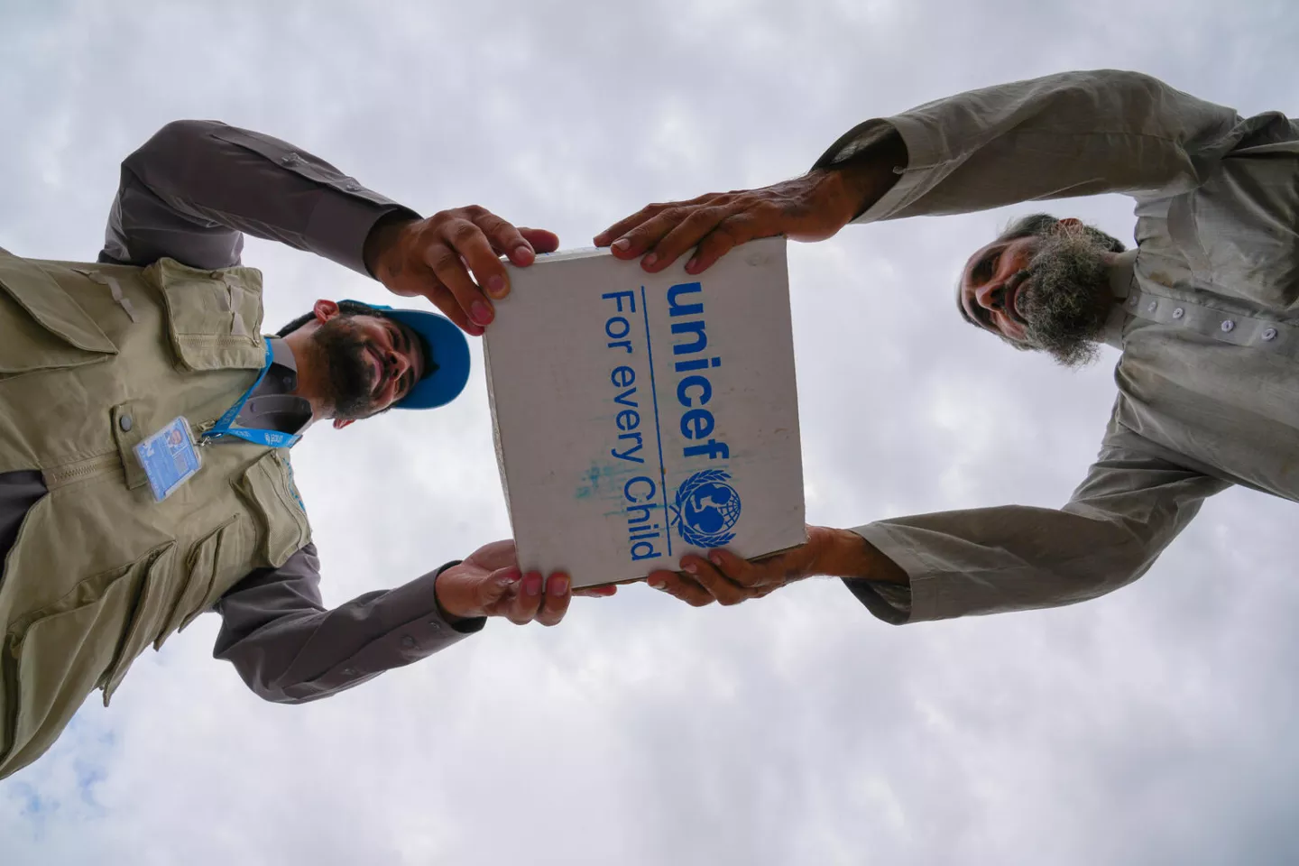 On 22 August 2022, UNICEF staff distributes hygiene kits in Jalalabad, Nangarhar Province, Afghanistan after a flash flood devastated the city. These kits, packed with shampoo, soap for bathing and laundry, towels, and sanitary pads are essential items for many families who lost everything.