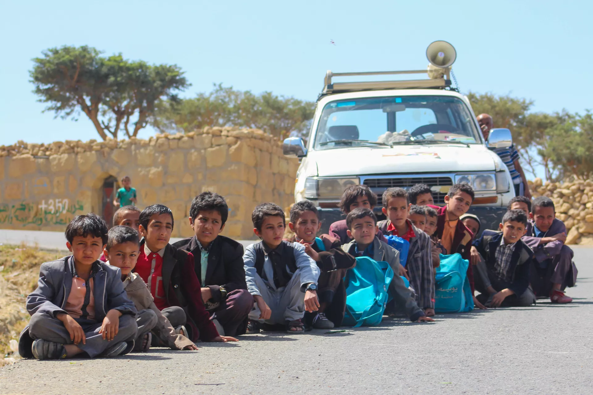 Children wait to be vaccinated in Dhamar, Yemen