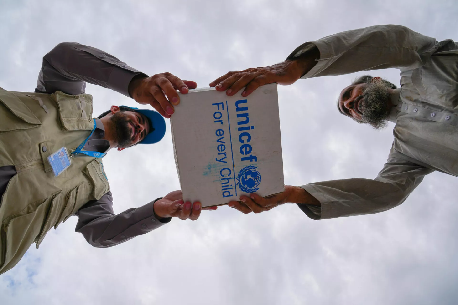 On 22 August 2022, UNICEF staff distributes hygiene kits in Jalalabad, Nangarhar Province, Afghanistan after a flash flood devastated the city. These kits, packed with shampoo, soap for bathing and laundry, towels, and sanitary pads are essential items for many families who lost everything.