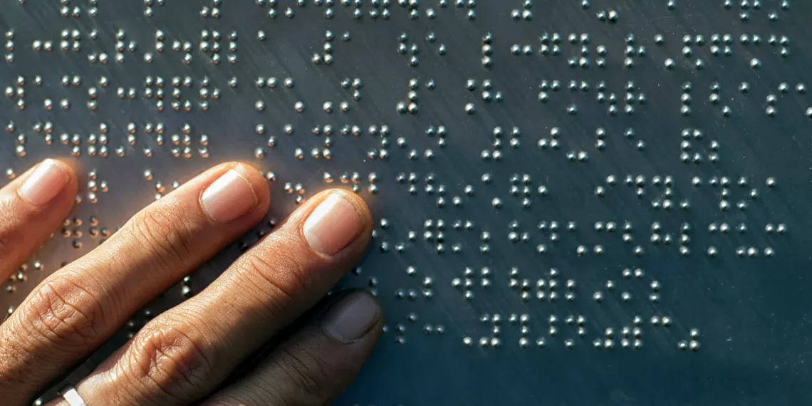 Fingers on a braille document