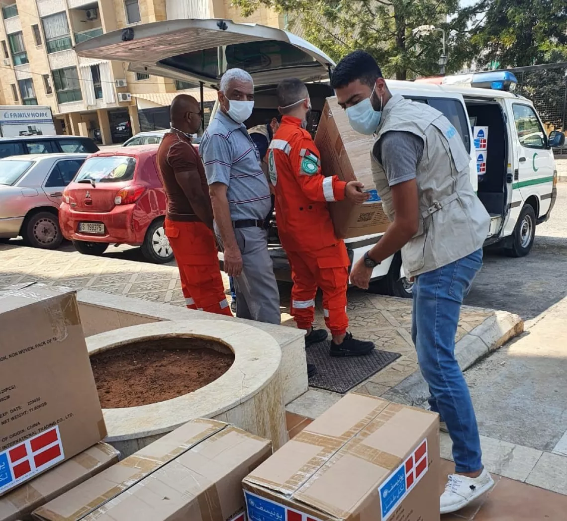 Khaled monitoring the distribution of supplies in Palestinian camps during the COVID-19 pandemic