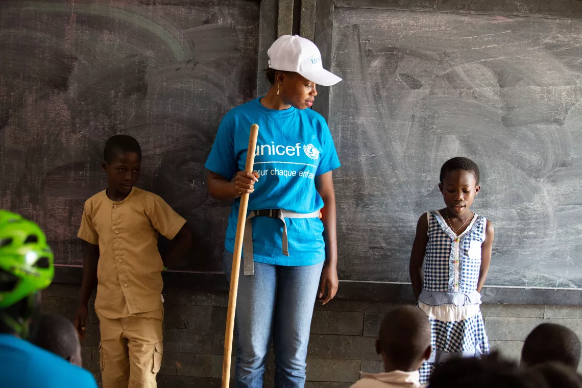 Yasmine with children in a classroom
