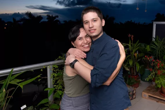 Cynthia and her son Marco embracing each other