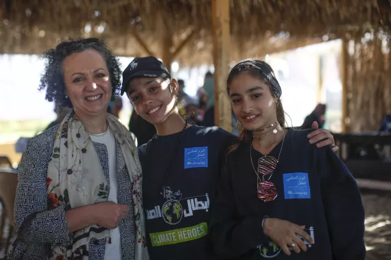Women smilin and embracing each other wearing shirts that read UNICEF