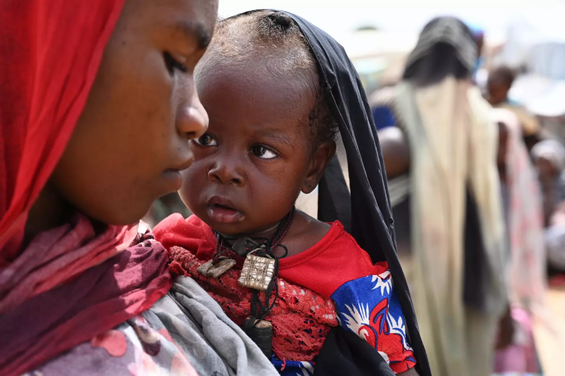Mothers and children at the refugee site of Adr&eacute;, in the East of Chad, close to the border of Sudan.
