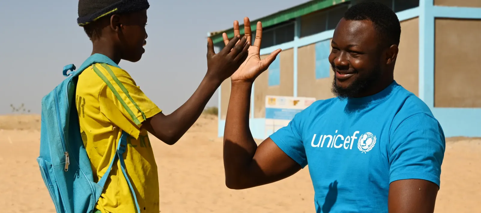 A UNICEF Staff member with a boy, at the playground of the preschool &lsquo;Garden d&rsquo;Enfants de Matafo&rdquo; in Bol, the Lac region, in the West of Chad.