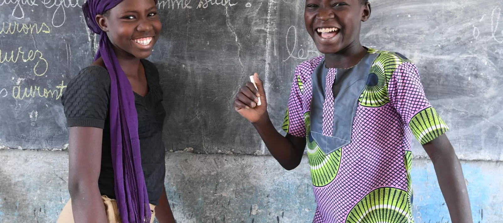 Students at the billboard of their class in a school in Habbenna, a suburban of Ndjamena, the capital of Chad. For every child, education.
