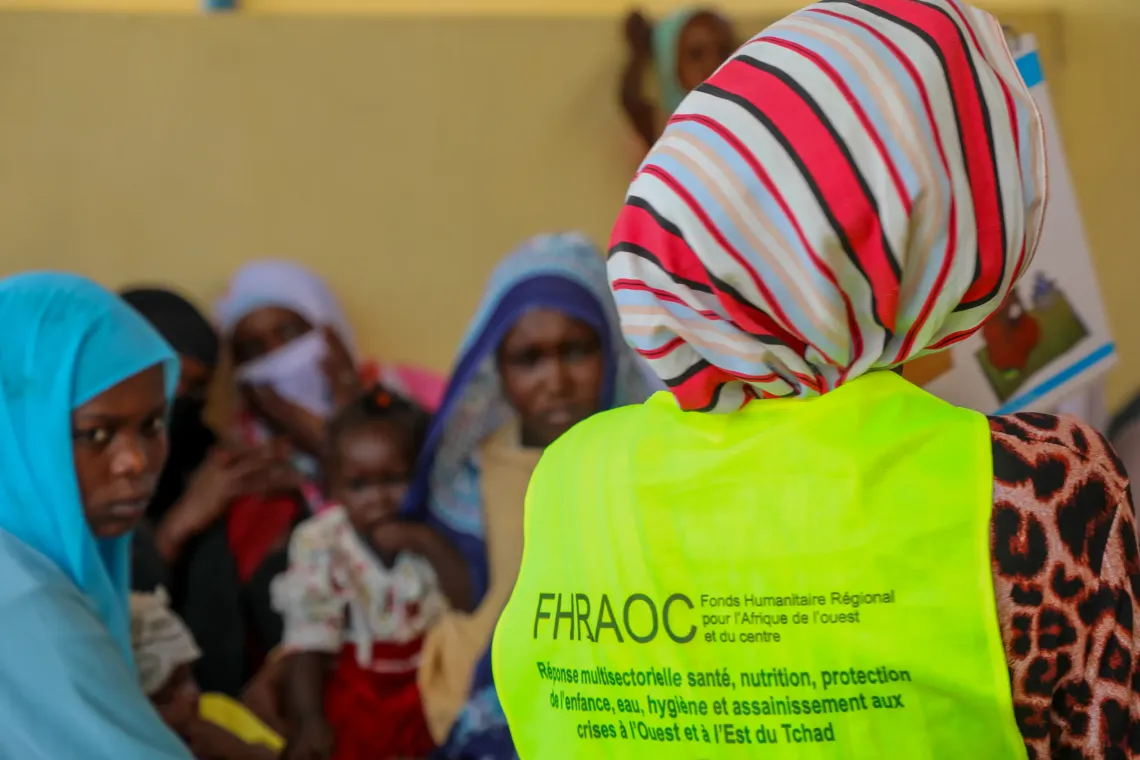 Alongside Zara, another community volunteer answers mothers' questions and shares practical advice on how to prevent malnutrition.
