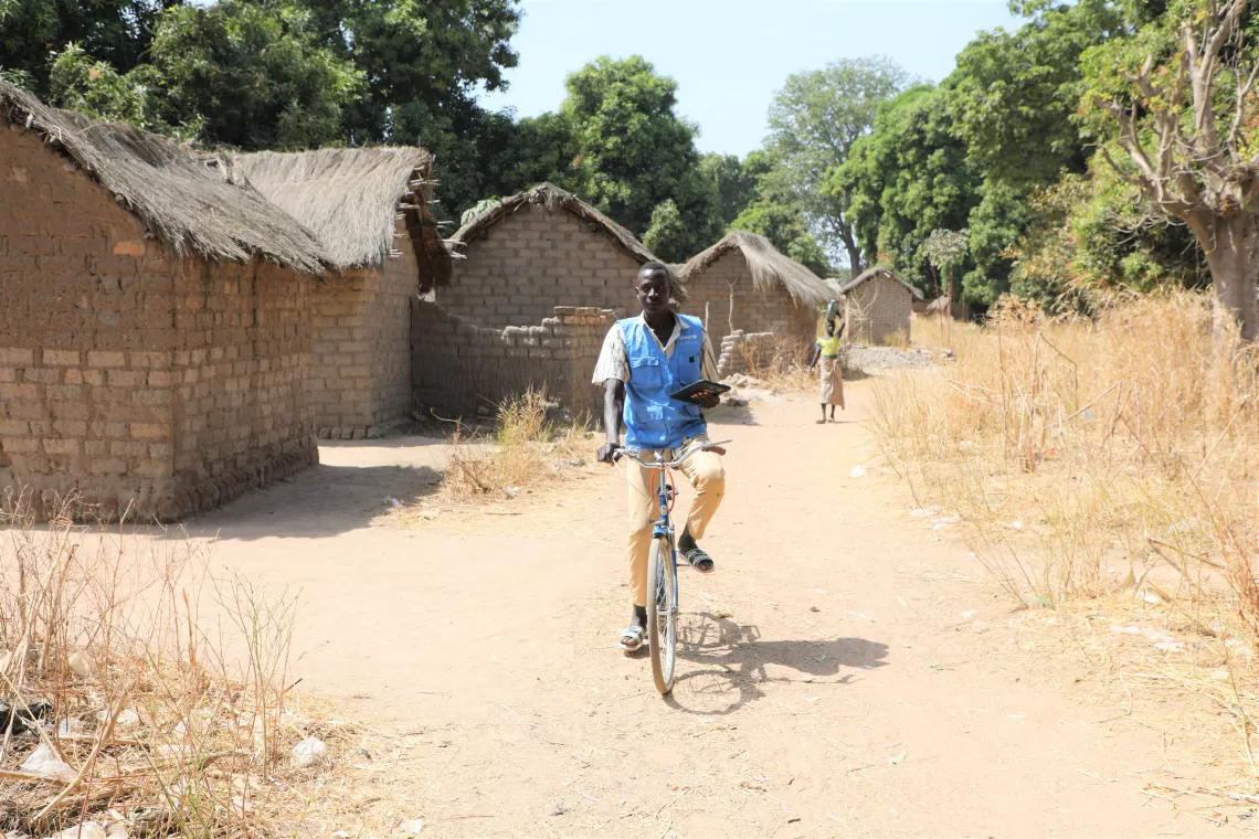 a community health worker on his bike