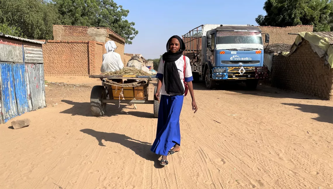 Ibtihal returning home from school