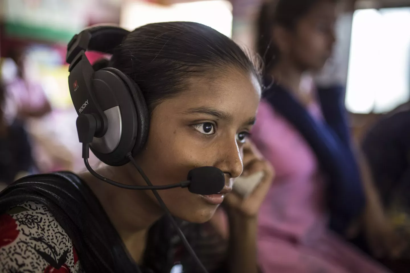 Sandhya Sahu listens to audio from a computer inside the Child Resource Centre in the Shivaji Nagar area of Mumbai, India. 
