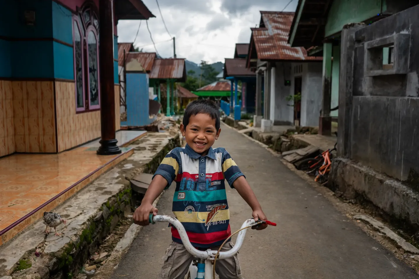 Rizki, 4, rides his bike in Tlogopakis village, Central Java province, Indonesia.