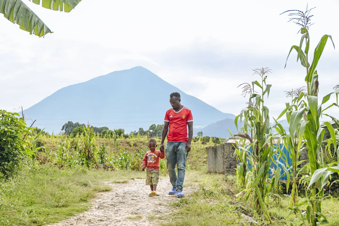 A father and son walking.