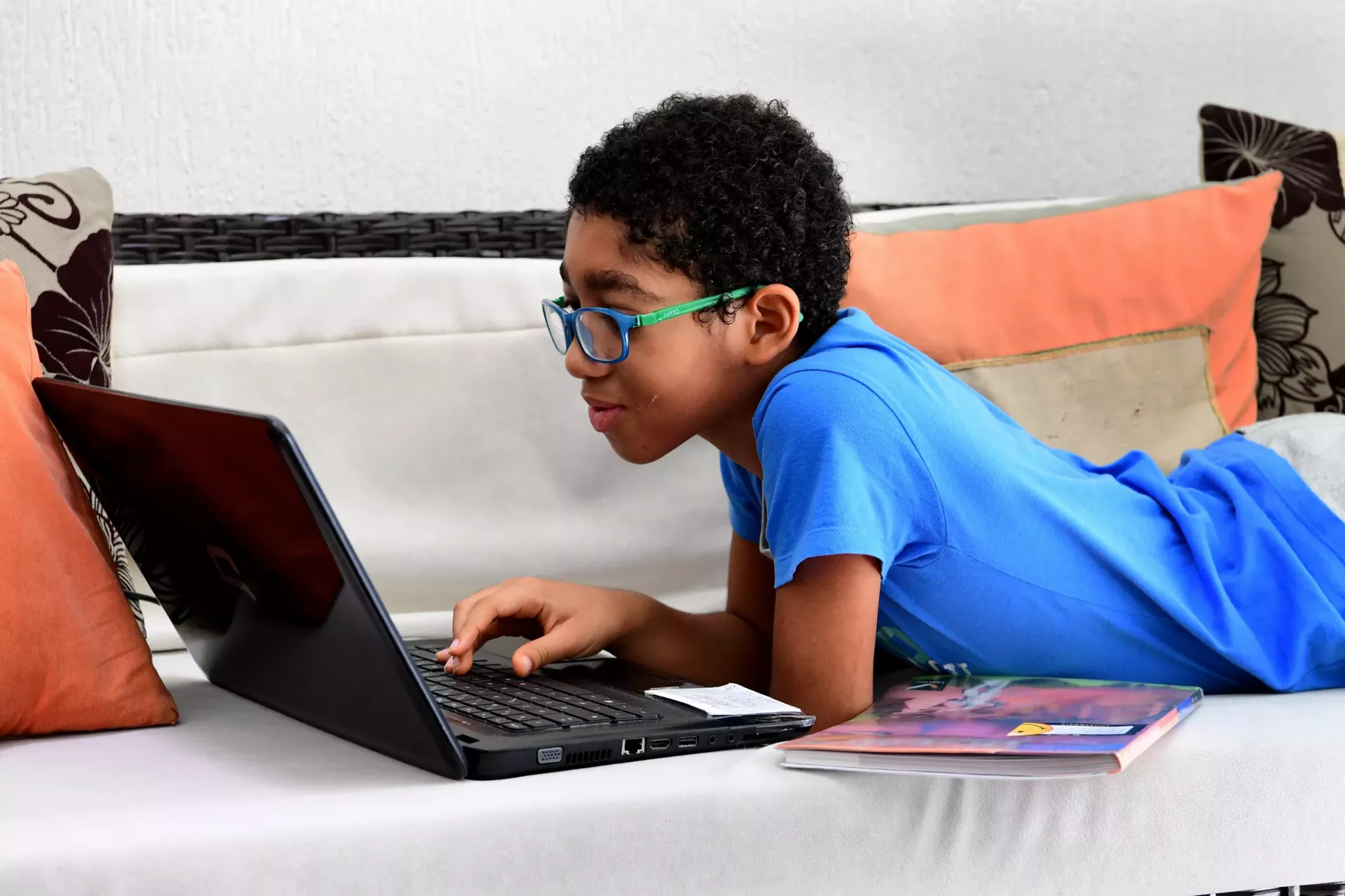 A child working on the laptop.