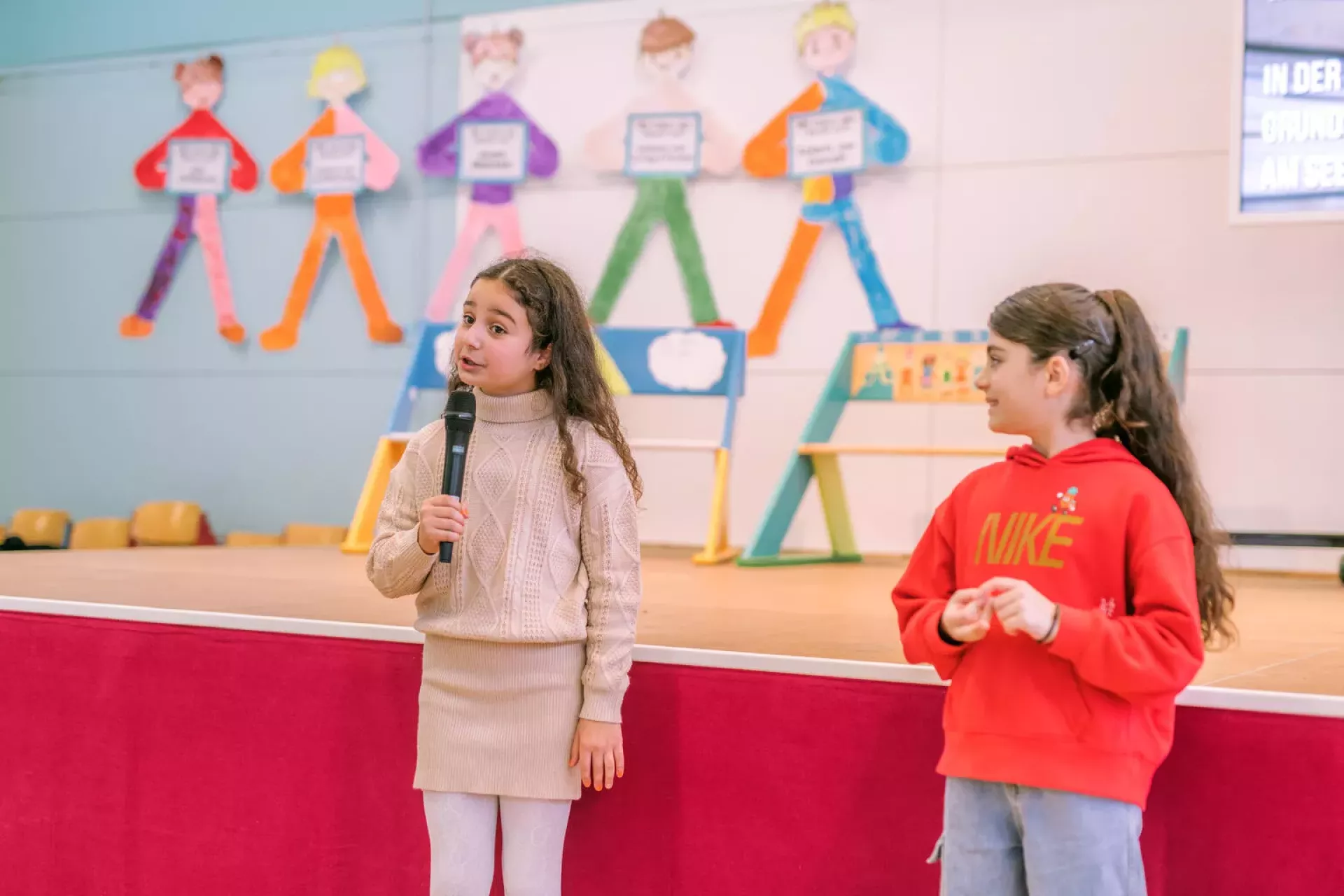 Two selected students moderating an event.