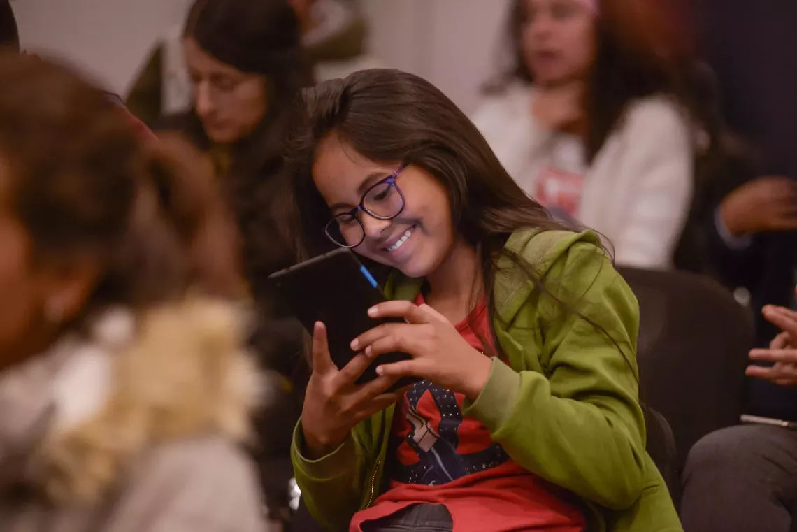 Online privacy - a girl uses a mobile device