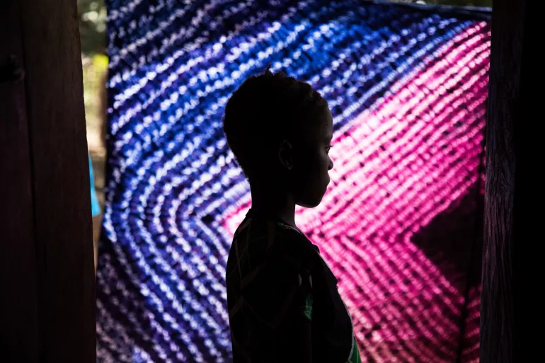 The silhouette of a girl.