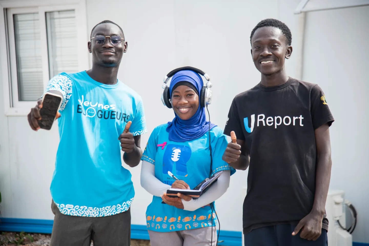 Henri, Myriam et Largaton, tous membres des programme d'engagement des jeunes de l'UNICEF
