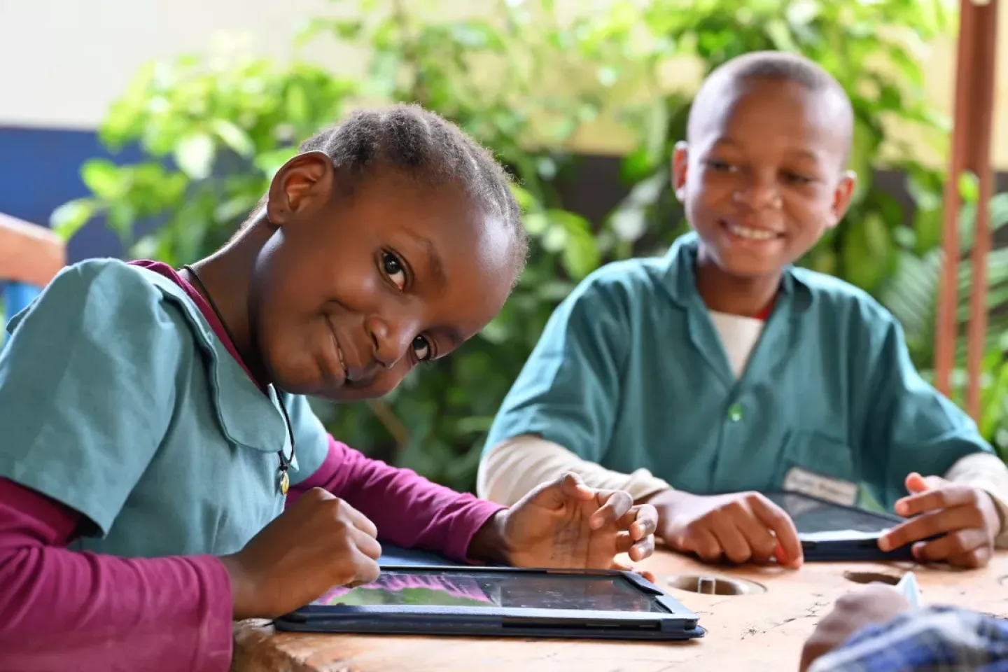Children learning on a tablet