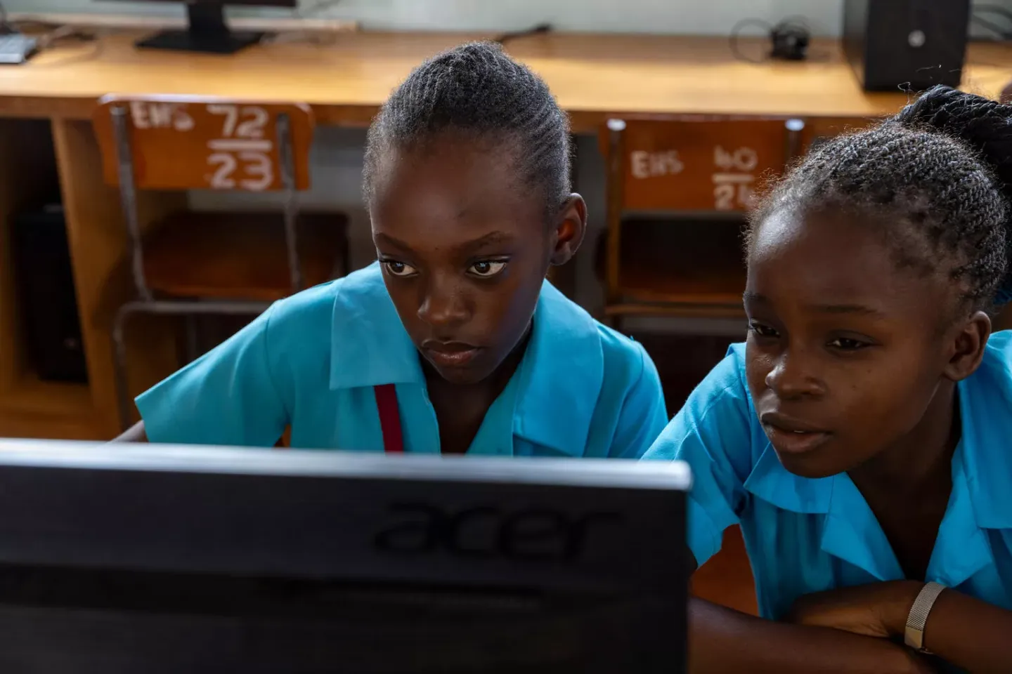 Two students studying on the laptop