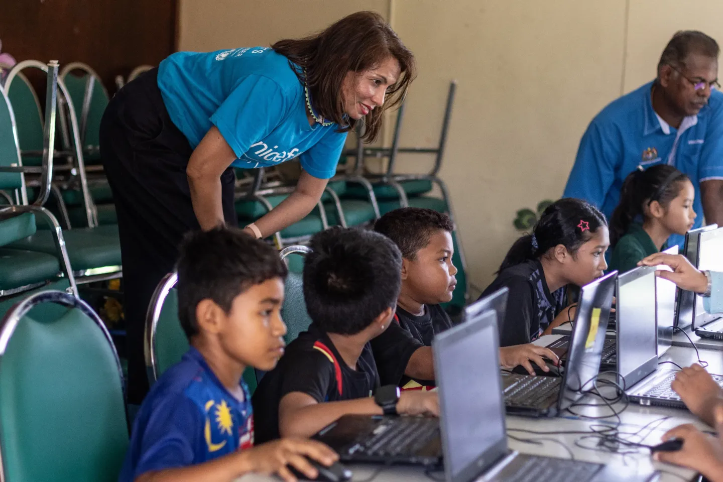 Teacher and students with digital tools