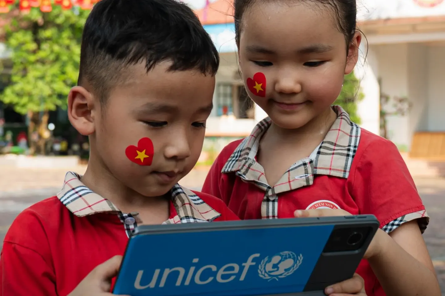 A boy and girl with tablet. 