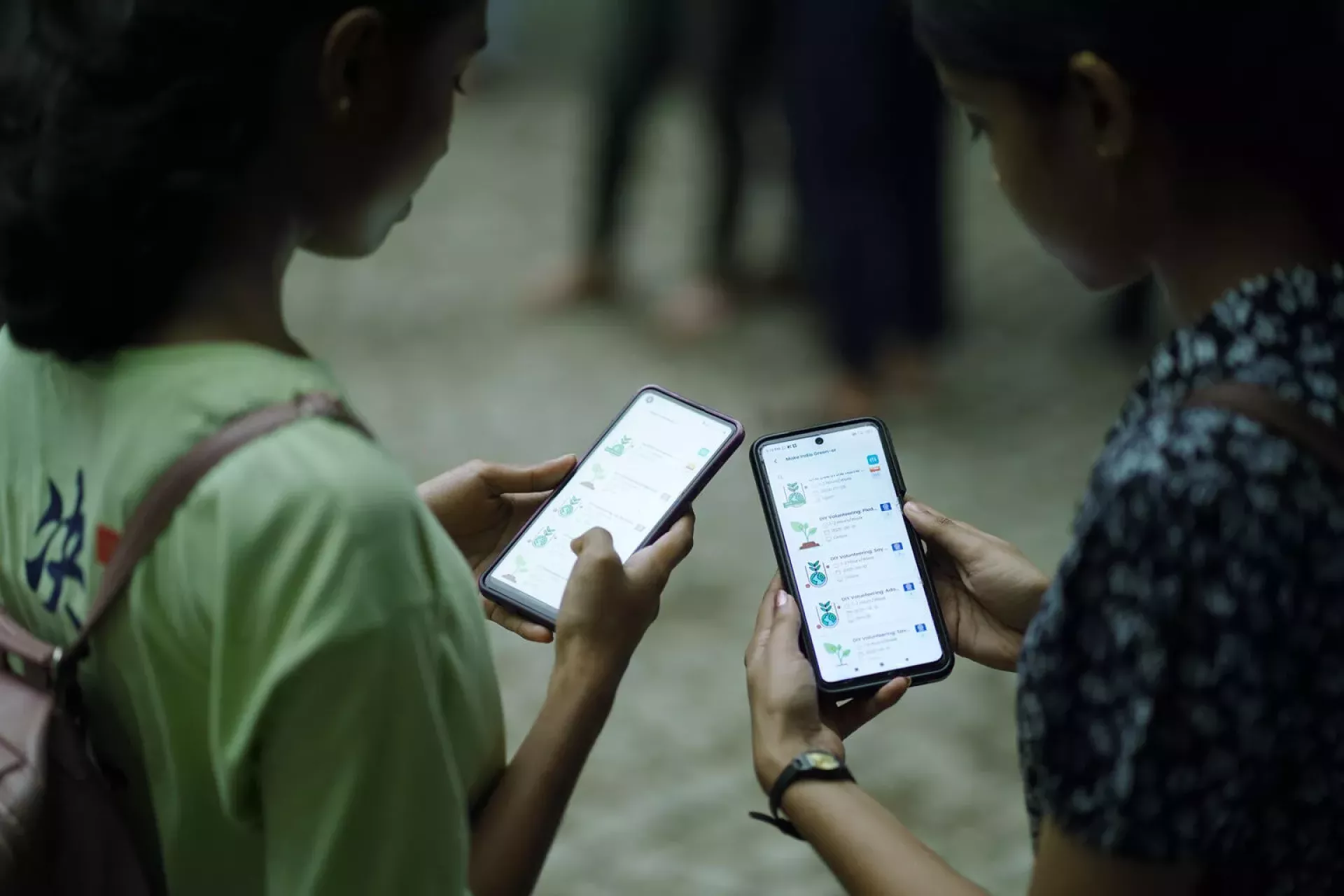 Diya and Megha Maria Lal browsing upcoming volunteering opportunities on the Meri LiFE App. Source: Shradhafilms, , Location: Kochi, Kerala