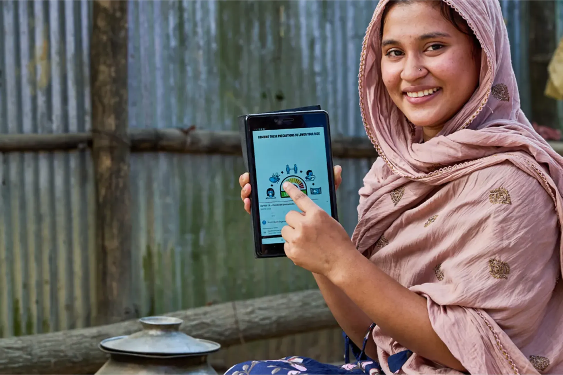 Rifa Moni (18) a participant of Jadimura BITA Social Hub. She received UNICEF training on basic computer literacy. Now she raises community awareness about different social issues using a tab.