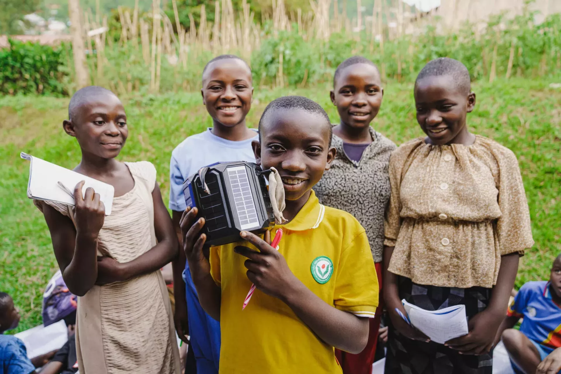 Amini, 12, is with her friends after attending classes at the group circle, courses taught via radio and in the presence of a teacher in Minova